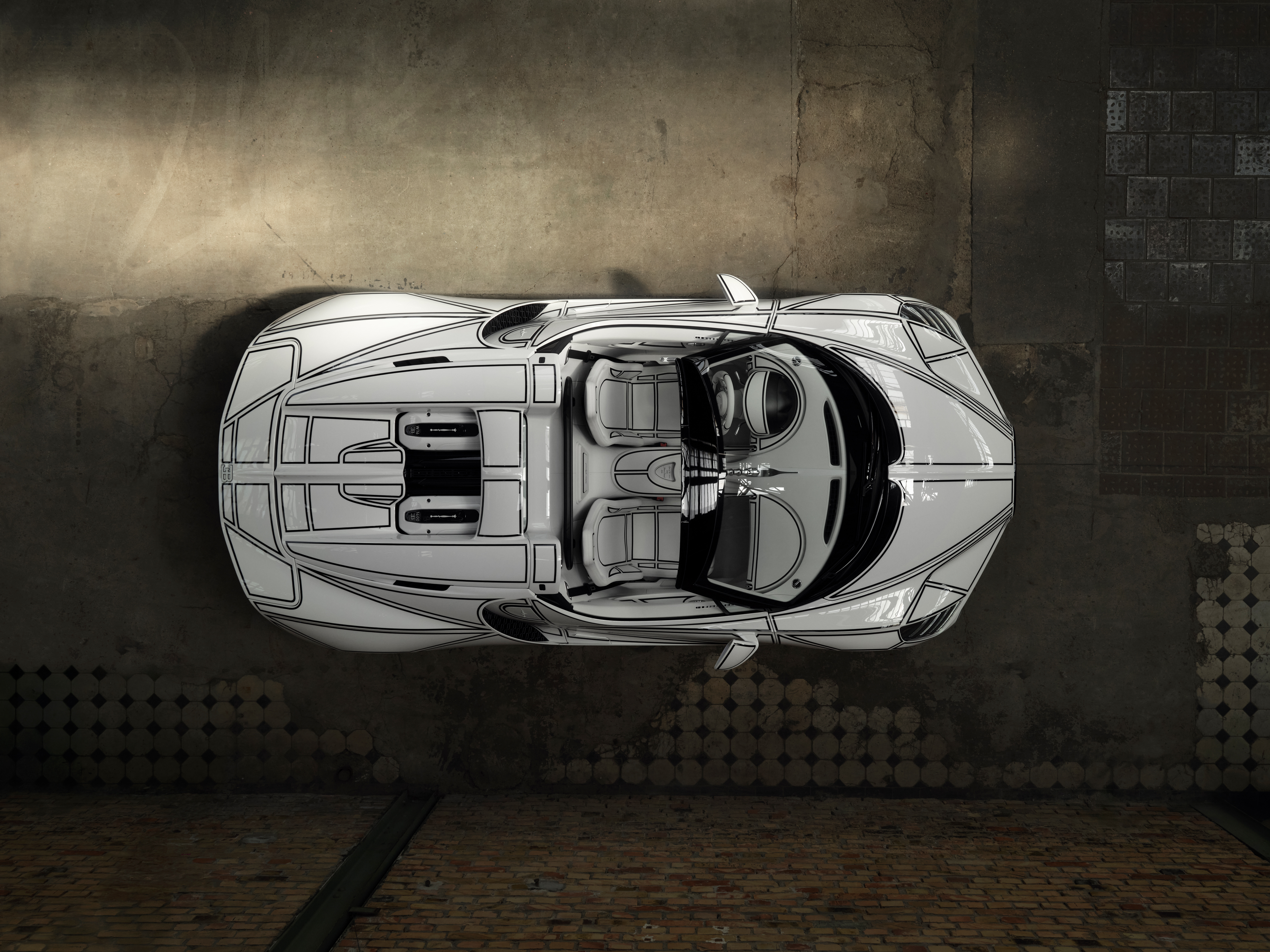 On the W16 Mistral “Blanc Éternel,” the digital patch layout – which is normally invisible but forms the basis of every car –  is made visible by black lines.